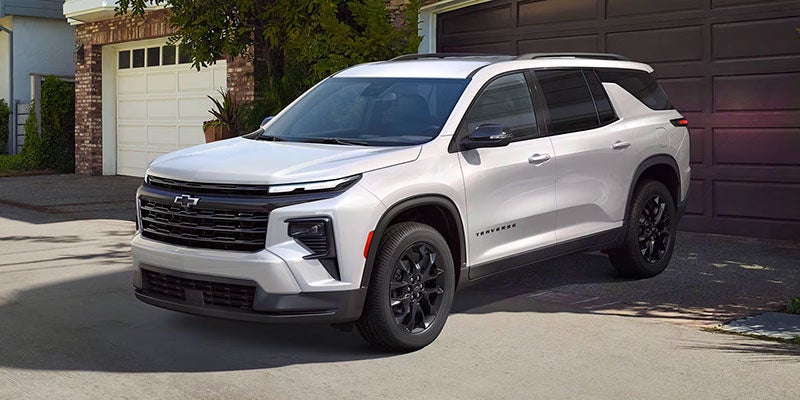 white chevy traverse standing outside home