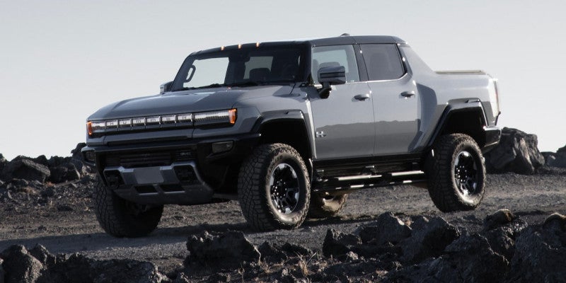 Gray Hummer EV running offroading